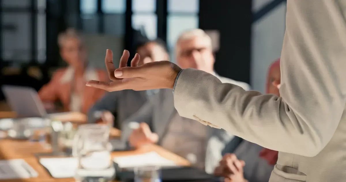 Presentation, meeting and hands of business people in office for discussion, financial review or feedback. Corporate speaker, audience blur and men and women for planning, collaboration or teamwork