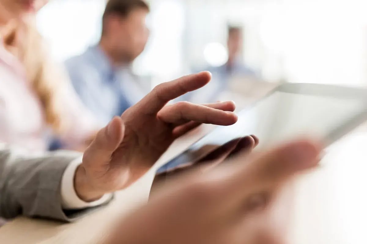 Close up of a business person working on touchpad.